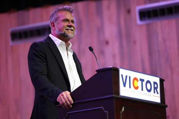Victor Marx speaking at a podium